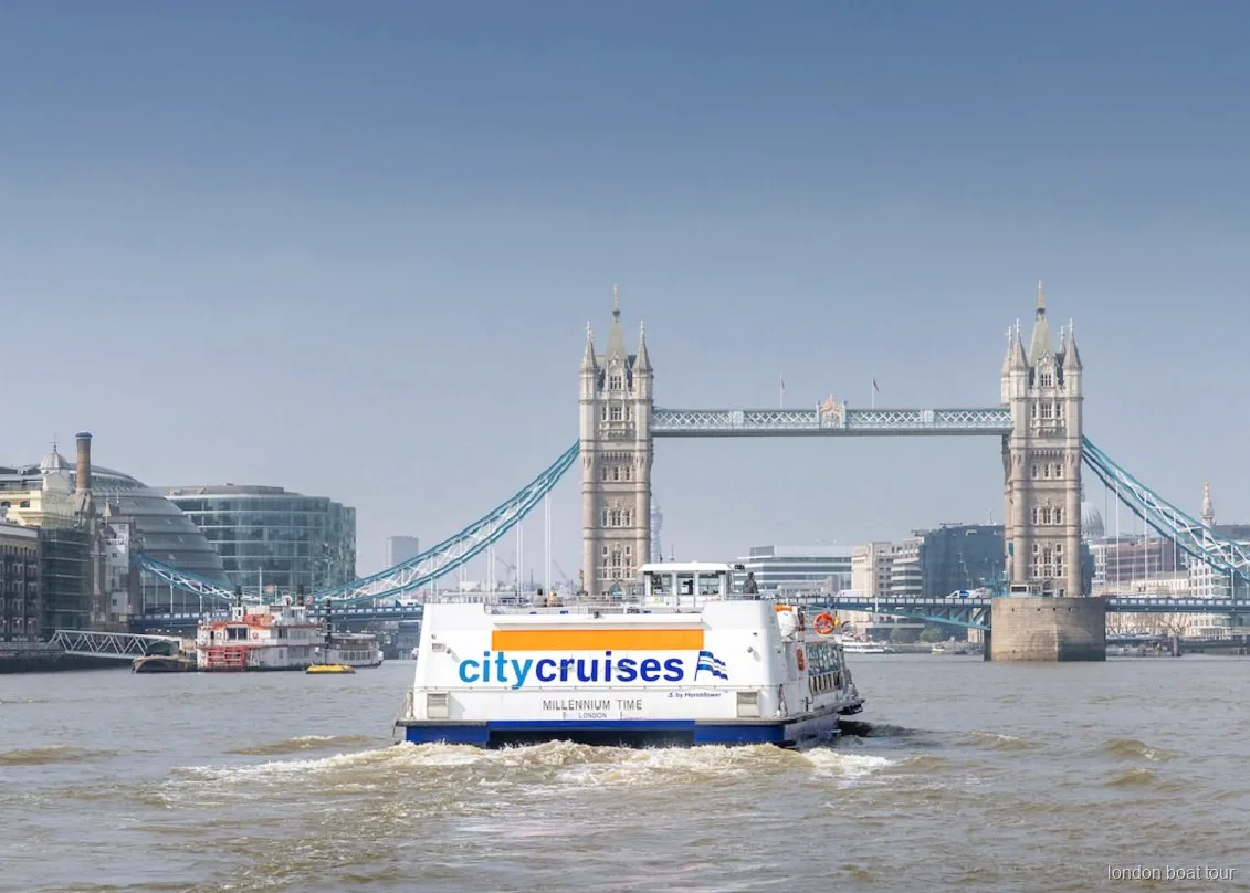 View of Tower Bridge from a Thames hop-on hop-off river cruise boat in London
