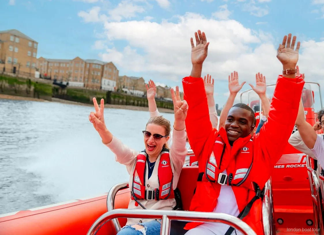 Thames speedboat throwing up spray near Tower Bridge during a speedboat tour